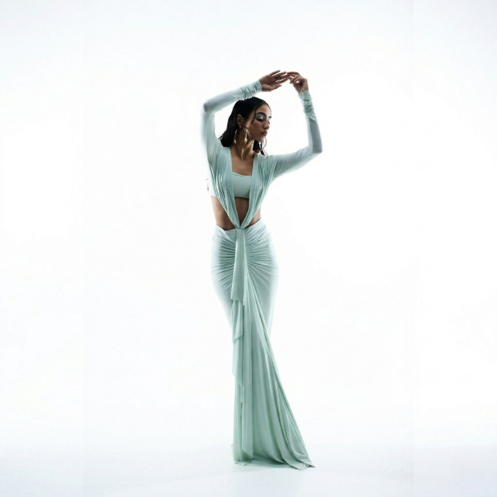 Sea green bustier dress with ruched bodice and pleated silhouette, perfect for parties and brunch. Shop online from our exclusive collection of premium designer styles.