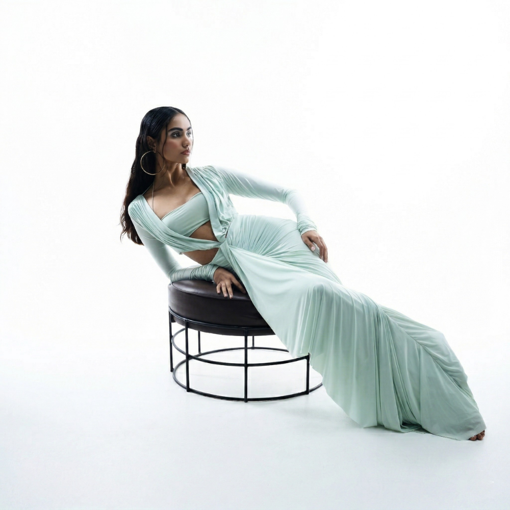 Sea green bustier dress with ruched bodice and pleated silhouette, perfect for parties and brunch. Shop online from our exclusive collection of premium designer styles.