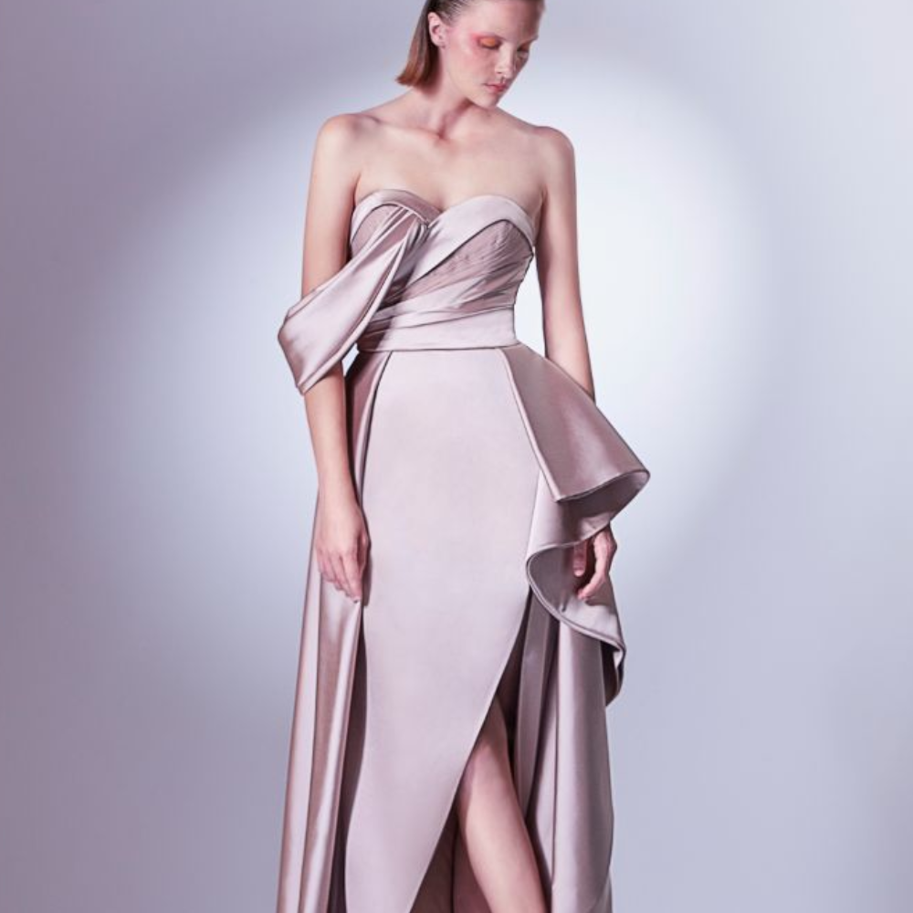 Asymmetric off the shoulder dress, designed in nude earthly colors. The bust is a marriage of satin and pleated tulle.