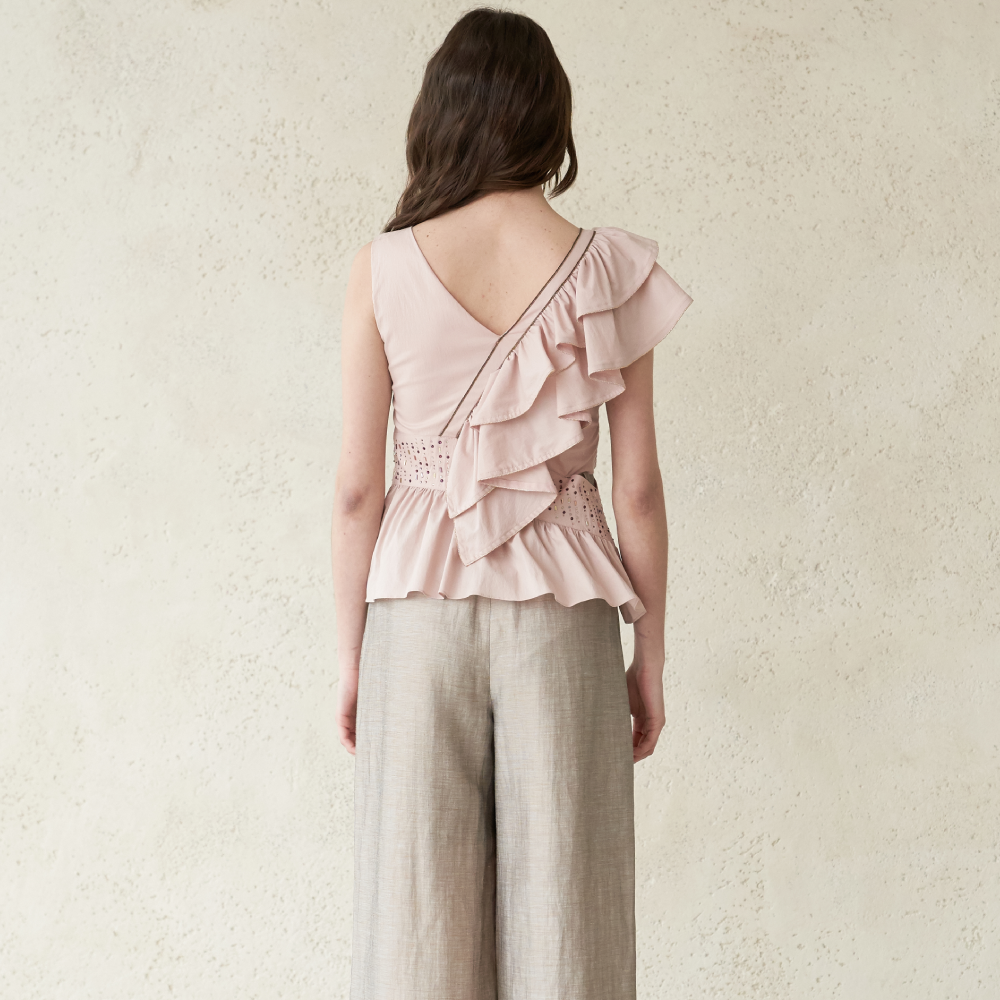 Light pink colored ruffled sleeveless blouse