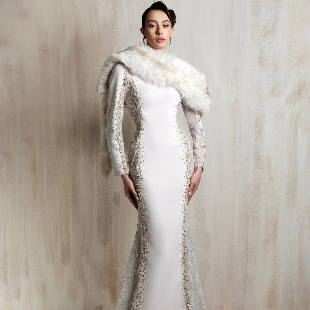 Off-white fitted gown with gold embellishments, designed for timeless elegance and refined glamour. Shop now at our exclusive clothing website.