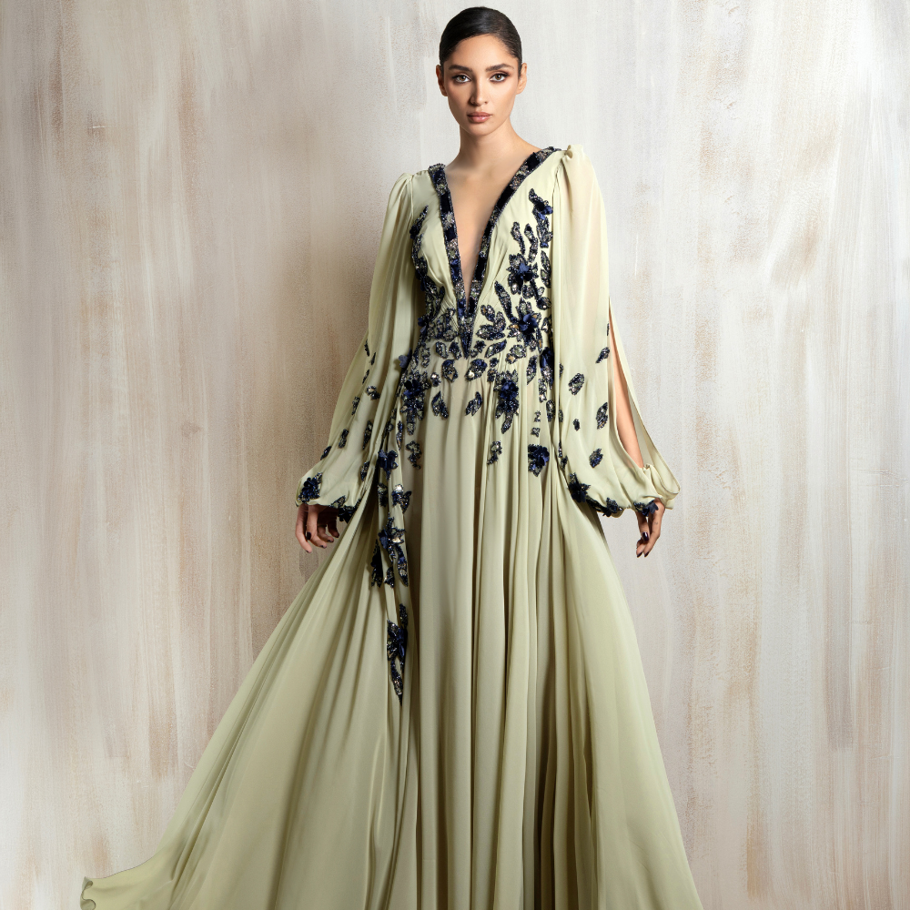 Flowing sage chiffon gown with floral embellishments, designed for effortless elegance. Shop now at our exclusive clothing website.