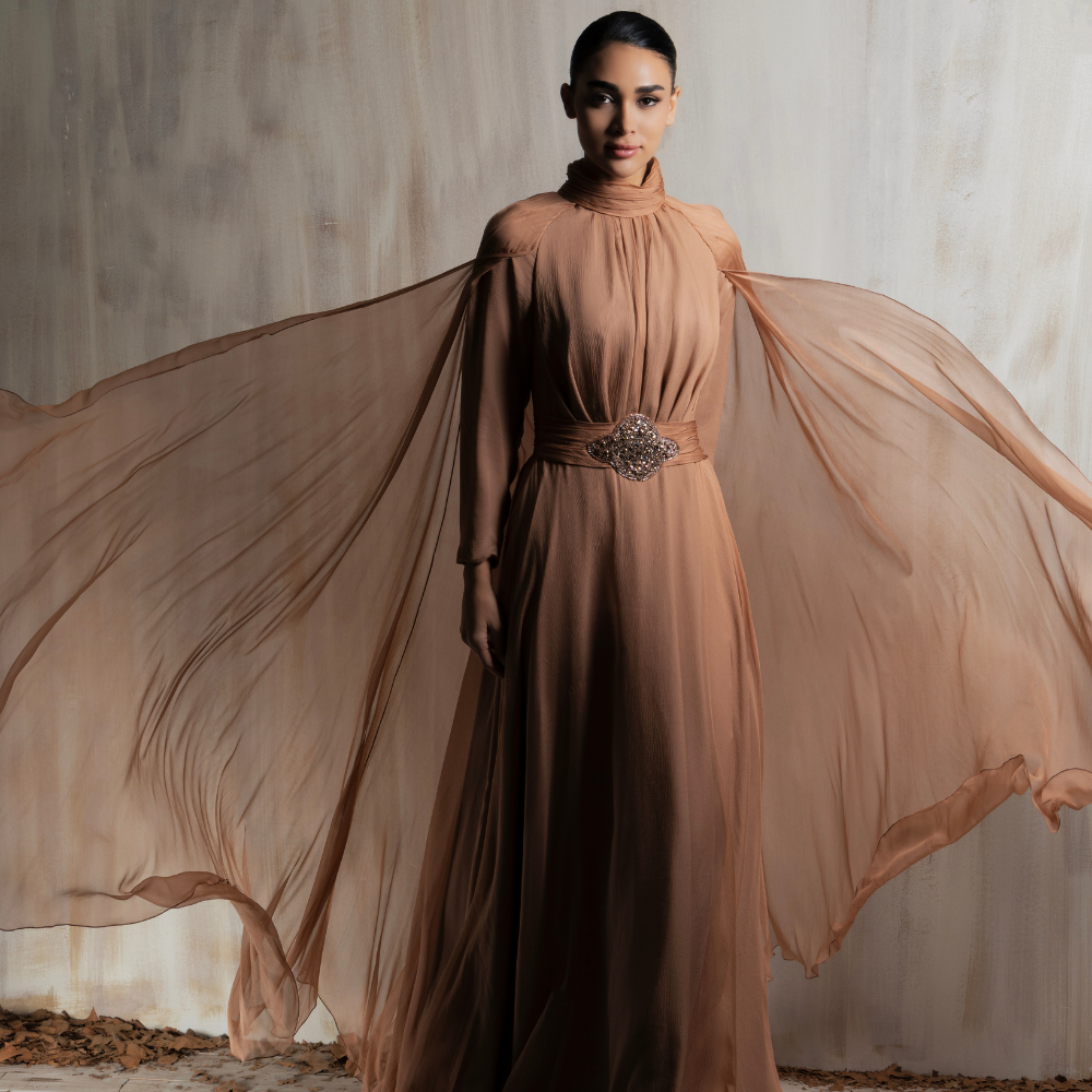 Flowing mocha chiffon gown with ethereal cape sleeves, designed for graceful elegance. Shop now at our exclusive clothing website.
