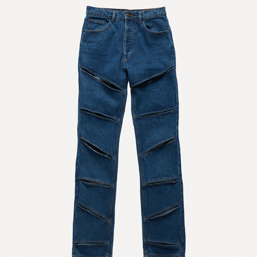 Natural off-white mid-weight 100% cotton organic denim with linear cut-outs. Cut for a mid-rise, straight-leg fit 