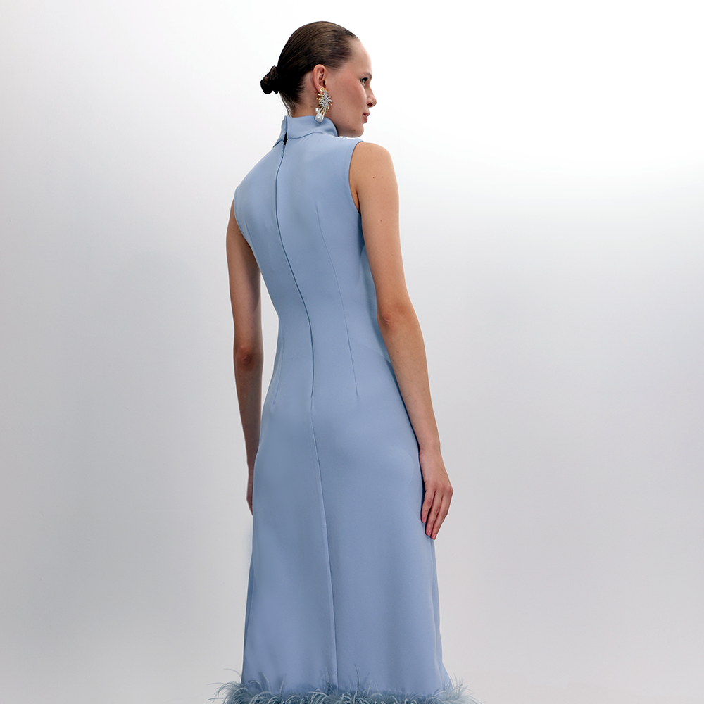 Introducing the Twist Knot Halter Neck Feather Dress with a tear drop opening, an elegant twist knot detail at the waist.