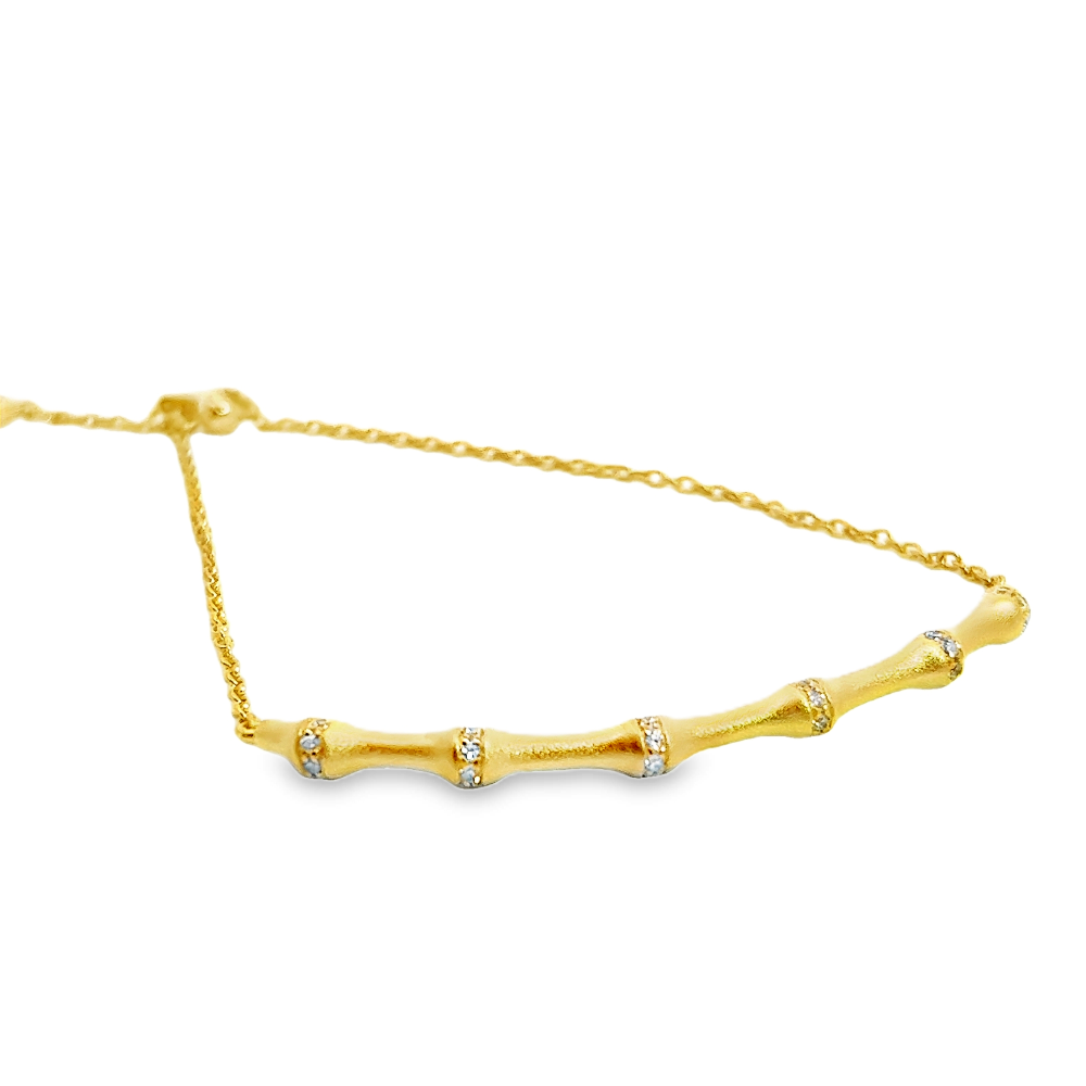 Sterling silver 18k gold-dipped bamboo bracelet with cubic zirconia accents for a sleek contemporary style. Shop premium jewelry online.