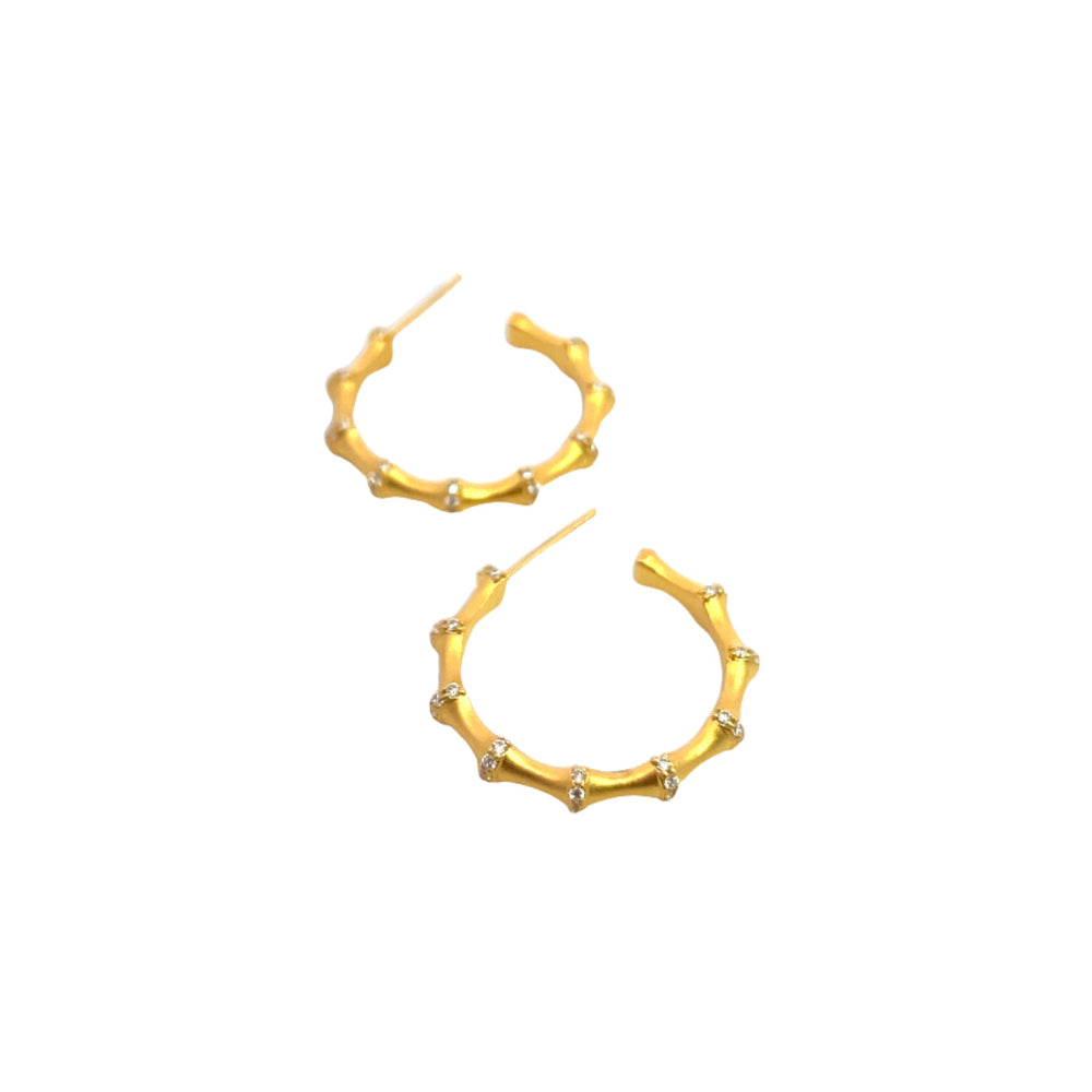 Shop online premium 18K gold bamboo hoop earrings with sparkling cubic zirconia stones.