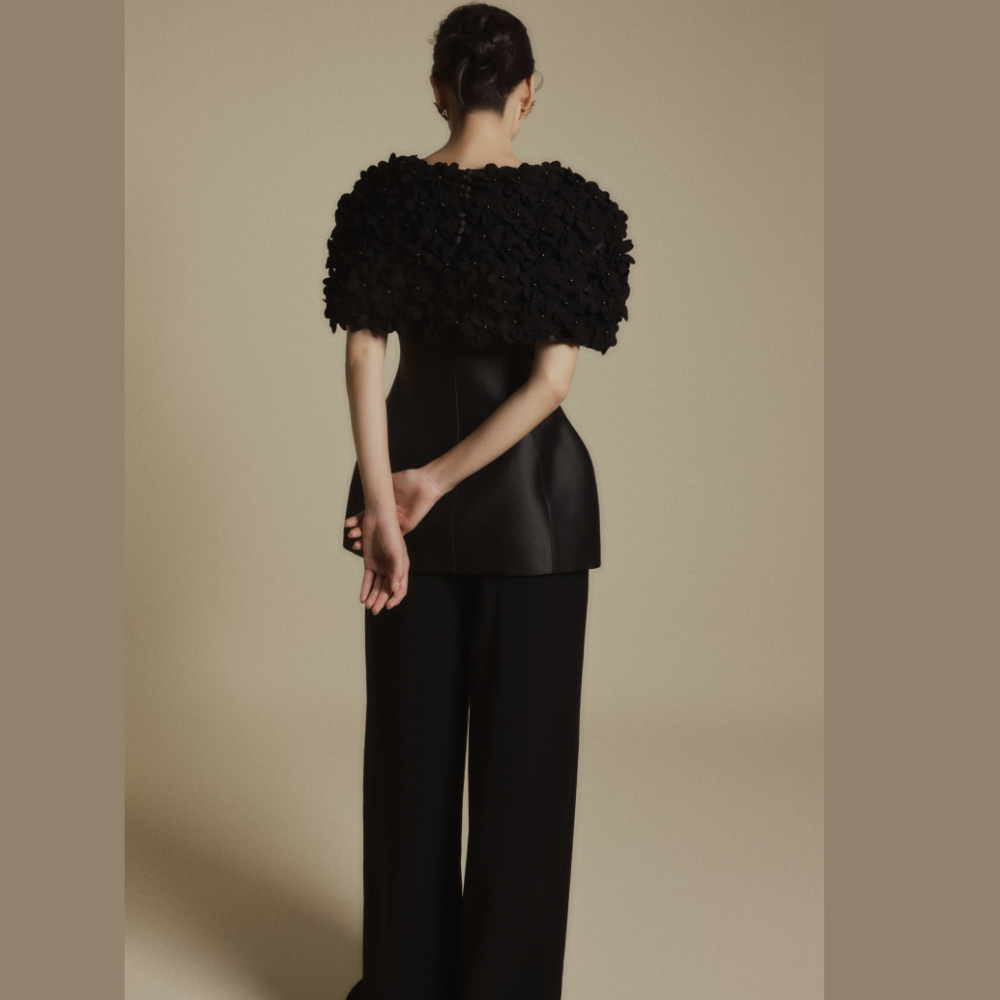 Discover chic luxury designer dresses paired perfectly with the Black Bloom 3D Floral Cape. Shop Now!