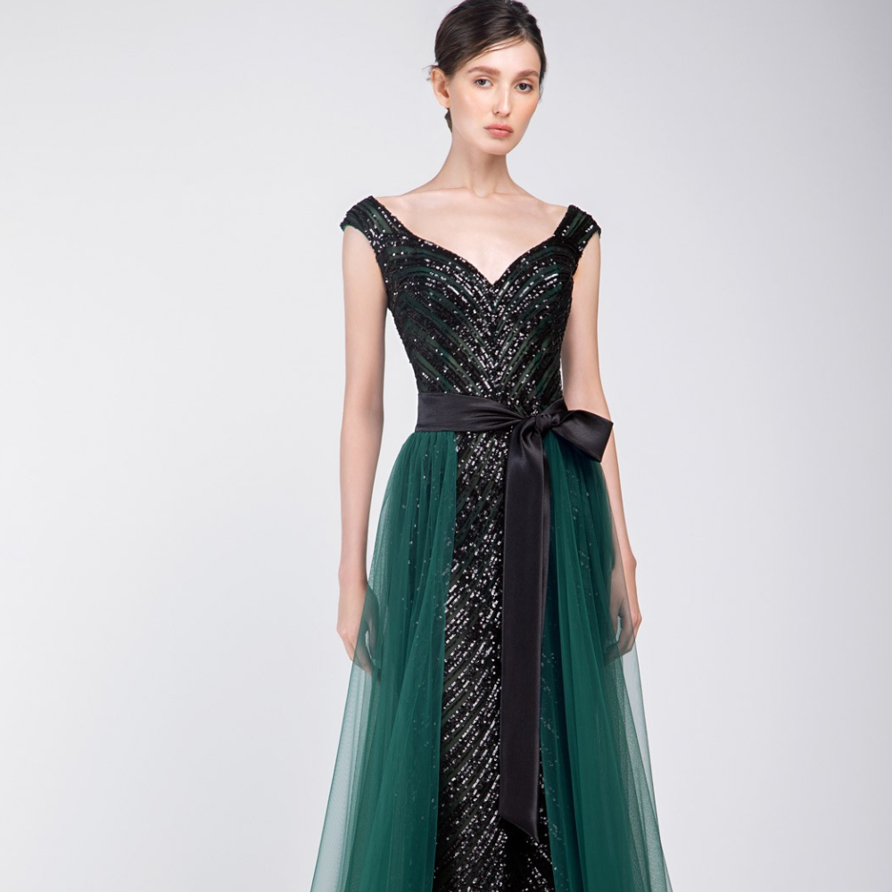 A unique Ready to wear dress. Black fully beaded sleeveless dress with V-neck and emerald green tulle overskirt.