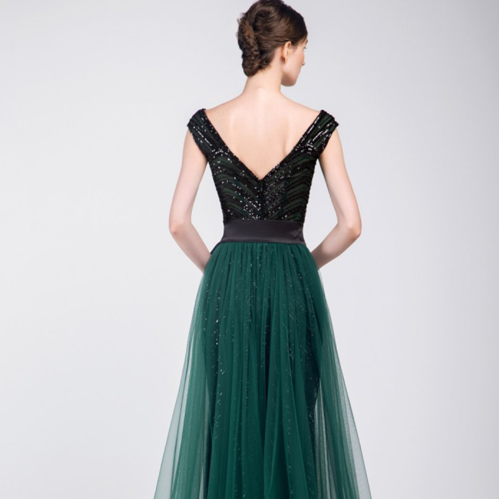 A unique Ready to wear dress. Black fully beaded sleeveless dress with V-neck and emerald green tulle overskirt.