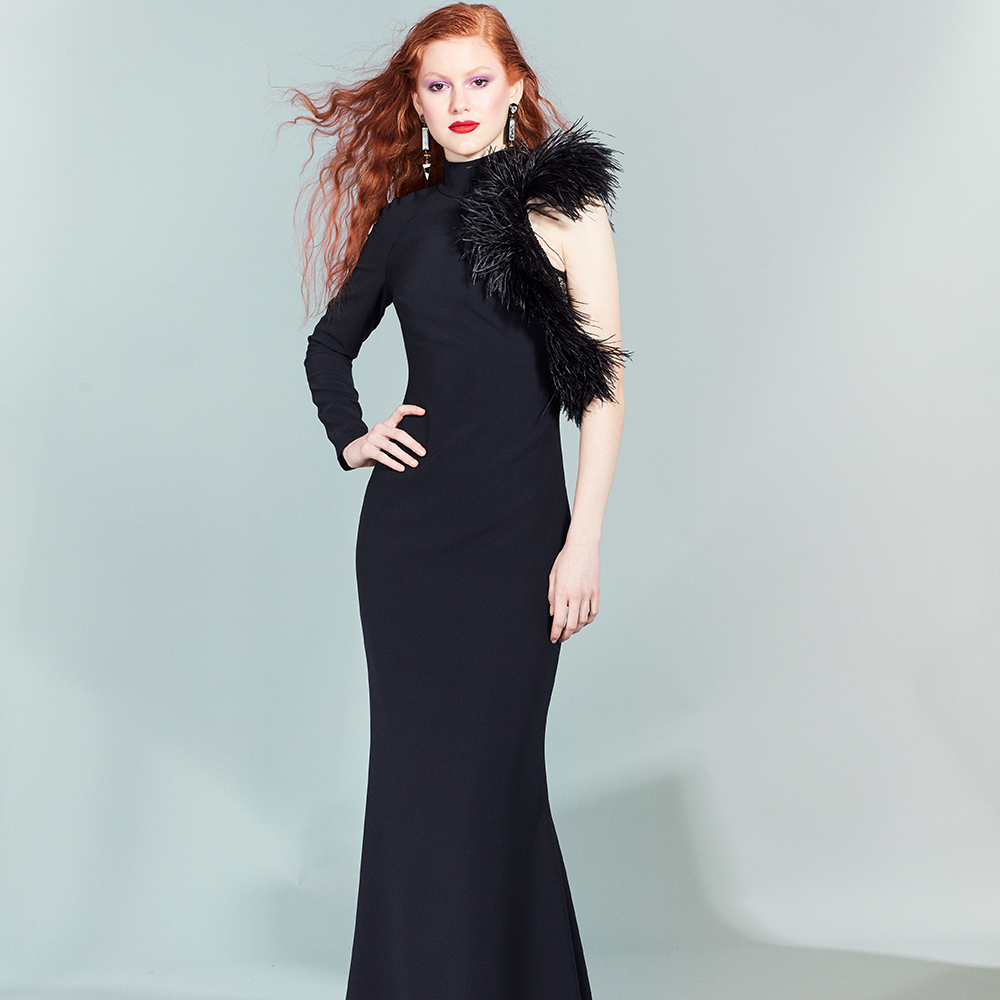 Austere black mermaid dress with train, this asymmetric sleeve piece has a shoulder.