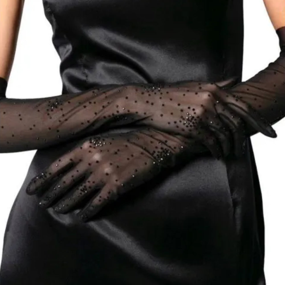 Black long gloves from stretch net with salute black crystals. These gloves are the perfect match for a night out.