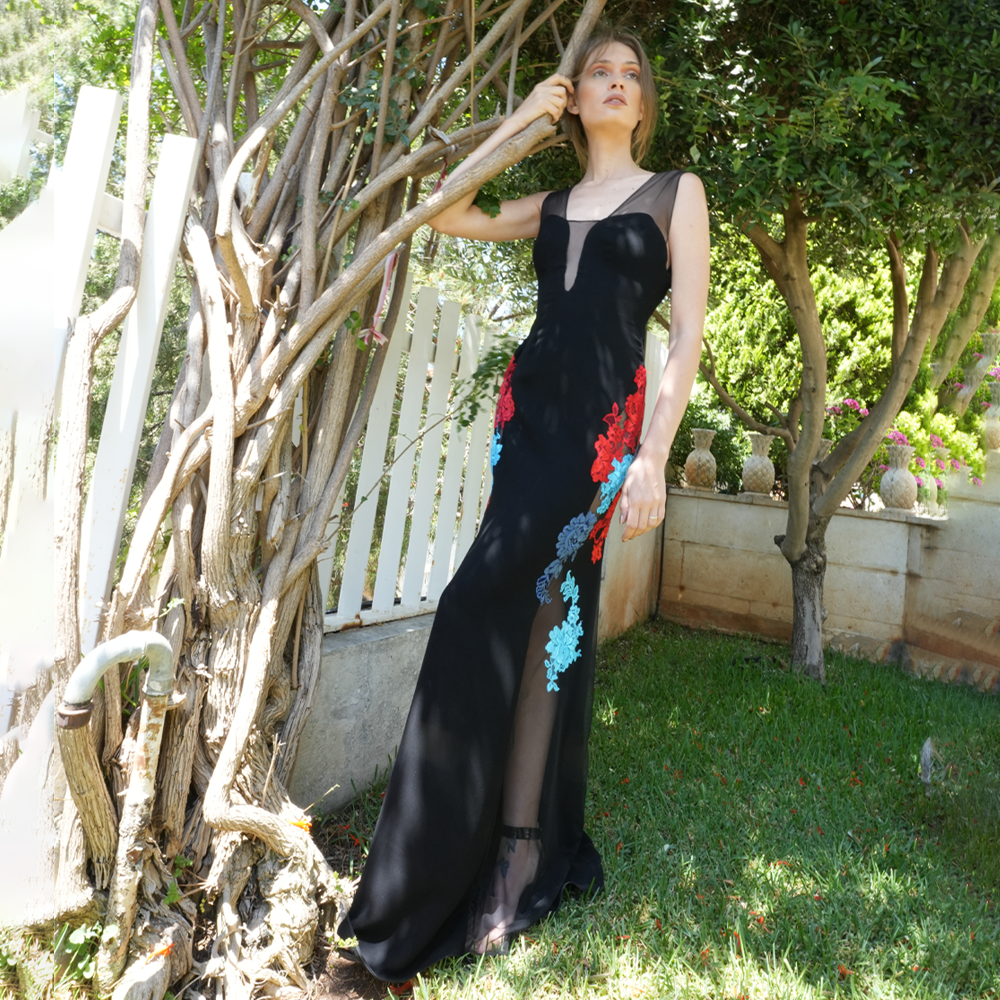 Black tulle and crepe dress with multicolor lace on the sides.