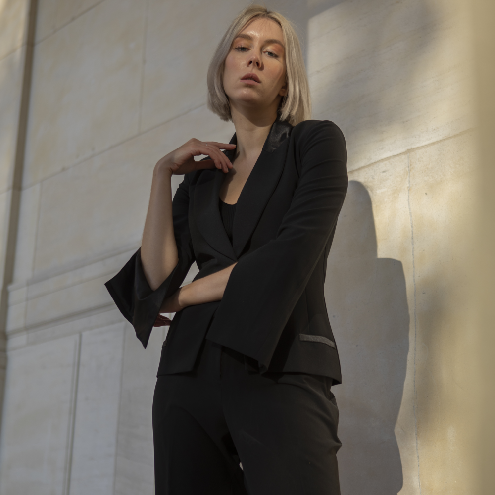 Carefully crafted in France, this sophisticated black tuxedo jacket features a relaxed cut with statement split sleeves. 