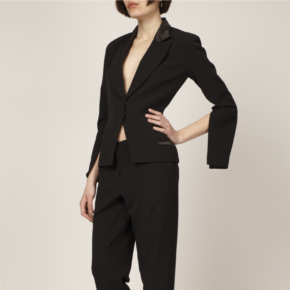 Carefully crafted in France, this sophisticated black tuxedo jacket features a relaxed cut with statement split sleeves. 