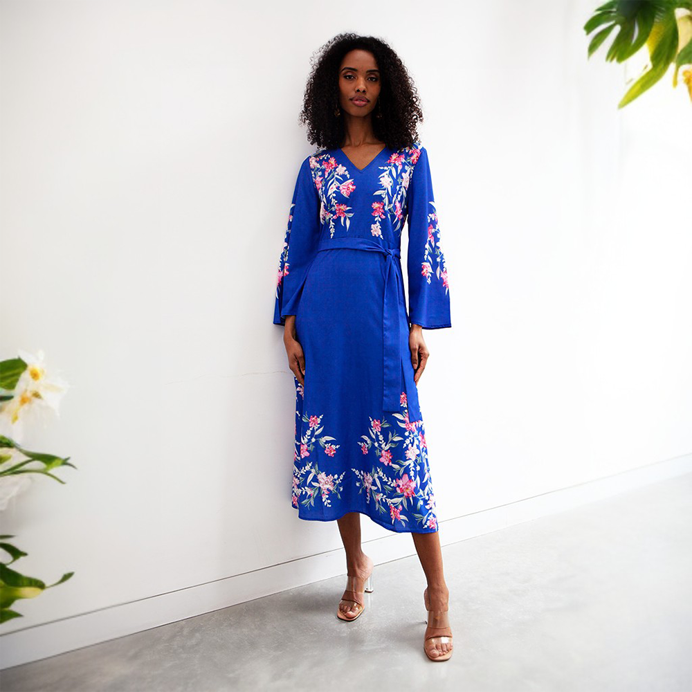 This vibrant blue midi dress features a V neckline, tie-up belt and full length sleeves.