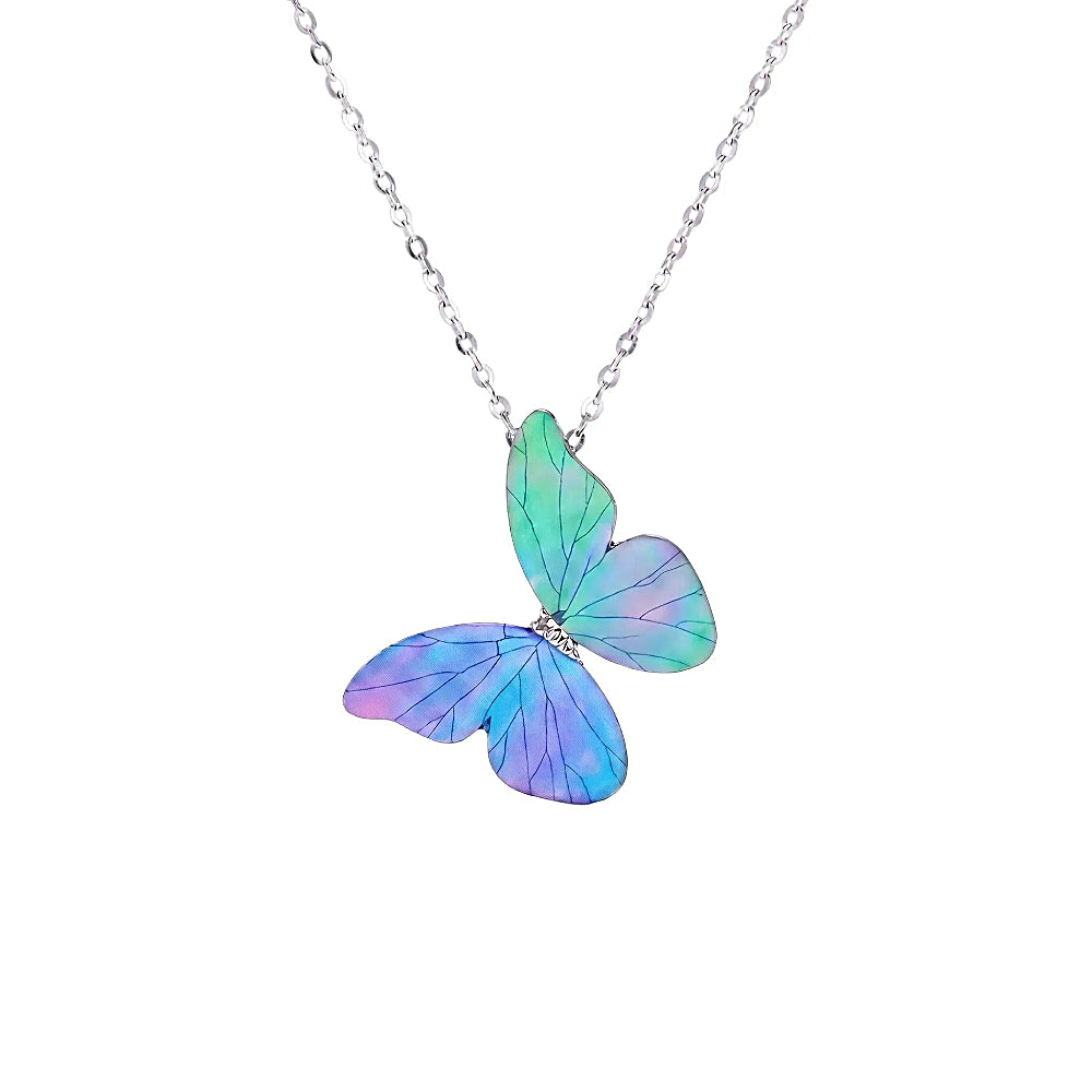 Discover the Blue Morpho Butterfly Necklace at The Luxe Maison, featuring iridescent mother-of-pearl inlay, traditional lacquer artistry, and a silver setting.