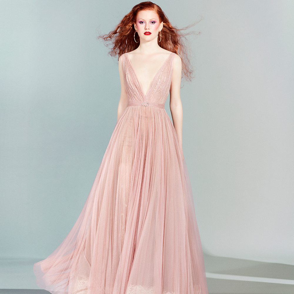 The piece from yolancris is a romantic a-line dress in light pink, consisting of a five-layer pleated tulle skirt.