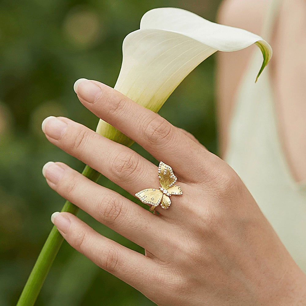 Discover the Butterfly Reverie Gold Vermeil Ring at The Luxe Maison, featuring a graceful butterfly design with a softly brushed gold finish and sparkling zircon accents. Crafted in 18K gold vermeil over S925 sterling silver, this adjustable open ring adds a touch of whimsical elegance to everyday wear and ring-stacking styles.