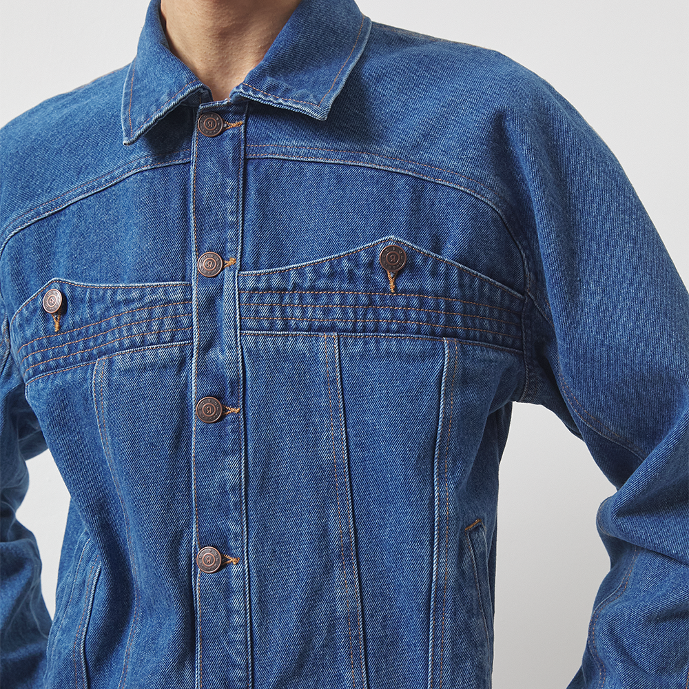 Dark blue 100% cotton organic stonewashed paneled denim jacket cut for a boxy fit. 
