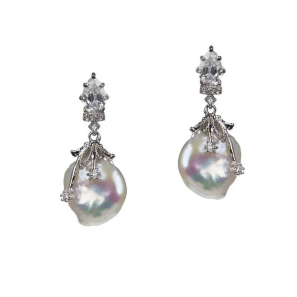 6 CTTW Pear and round cubic zirconia with freshwater pearl drop. Post earring set in rhodium-plated brass.