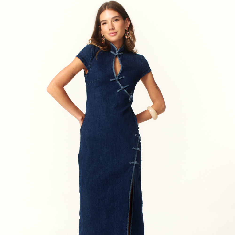 Shop the Camille Denim Midi Dress at TLM, featuring a tailored fit, high neckline and front slit. Explore luxury fashion on The Luxe Maison website.