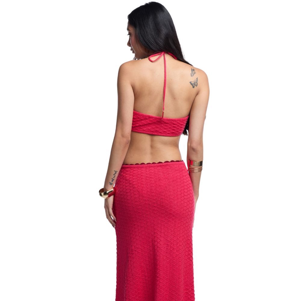 Shop the Carla Red Maxi Dress at TLM, featuring a crochet flower halter neckline, beaded details and waist cut-outs. Explore luxury fashion on The Luxe Maison website.
