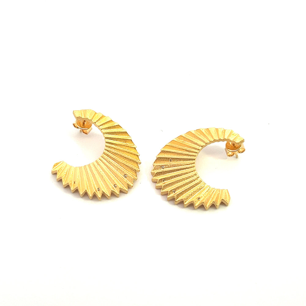 Shop online premium 18K gold statement earrings with wave design and sparkling cubic zirconia.
