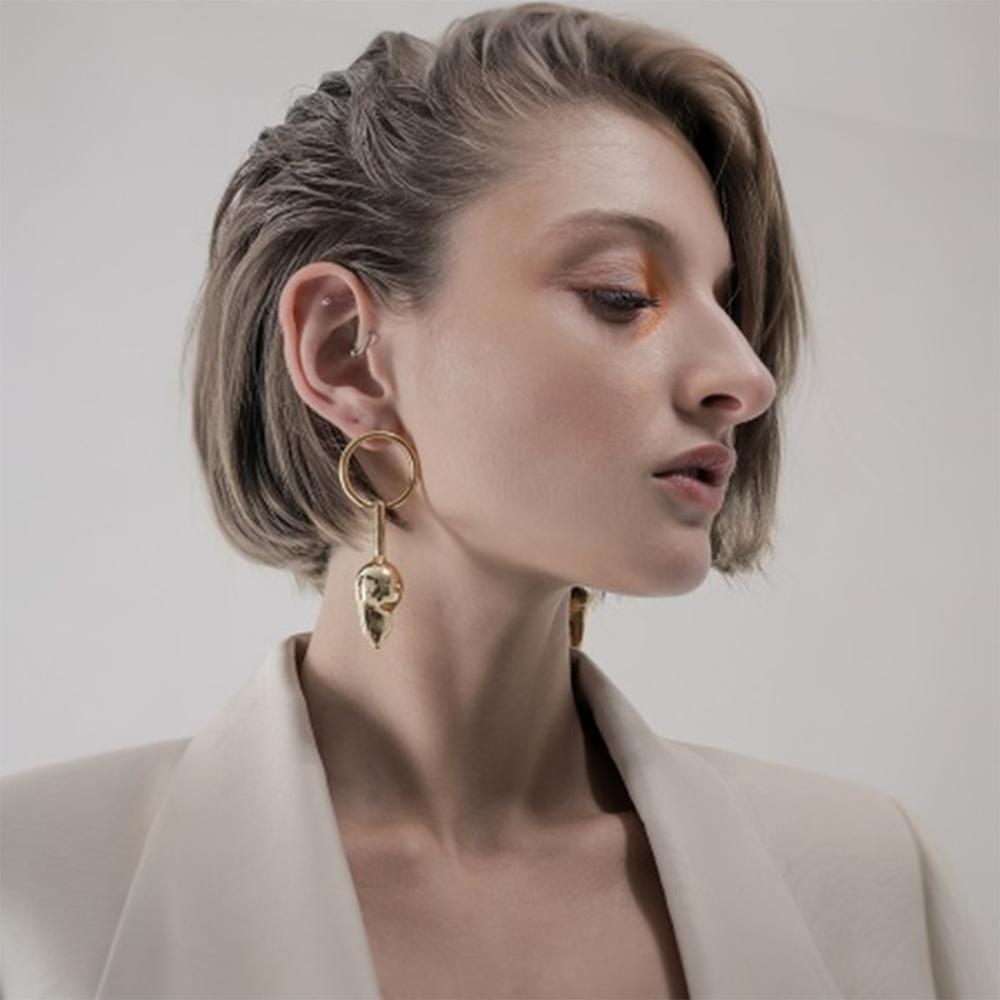 Baroque pearl shaped gold earrings.