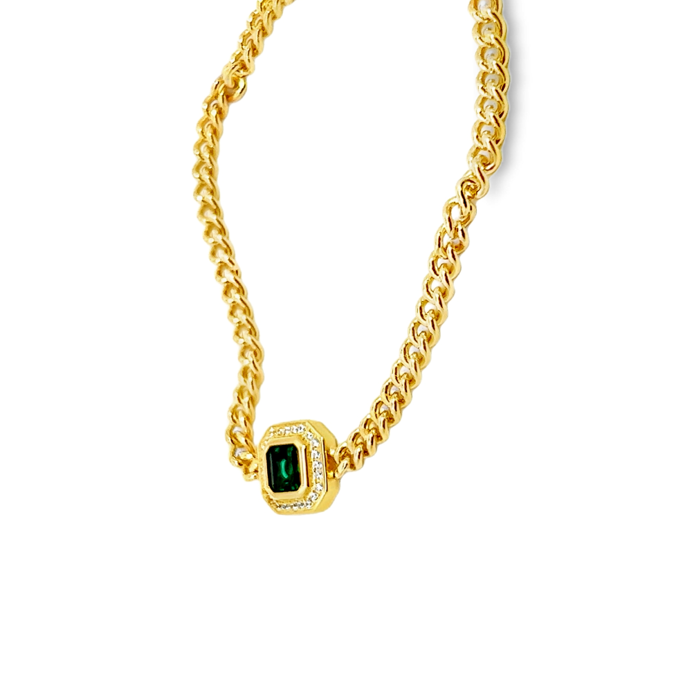 Sterling silver 18k gold-dipped bracelet with a lab-created emerald centerpiece surrounded by sparkling cubic zirconia accents for a refined modern style. Shop premium jewelry online.