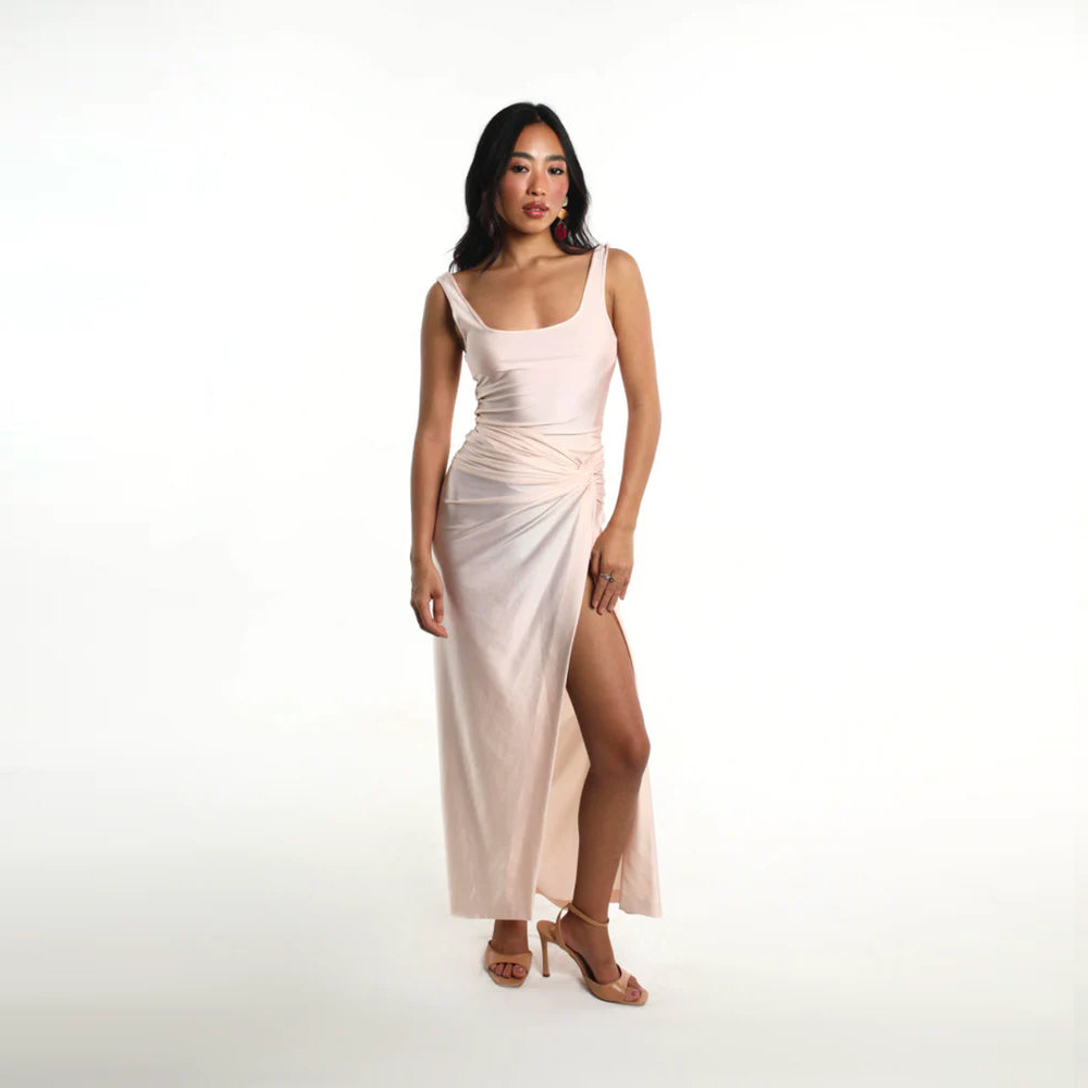 Blush slip dress with ruched drape and side knot, perfect for brunch and events. Shop online from our curated edit of premium fashion.