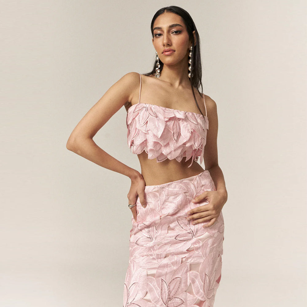 Pink bustier set with embroidered skirt and sequin detail, perfect for outings. Shop online from our curated edit of premium fashion.