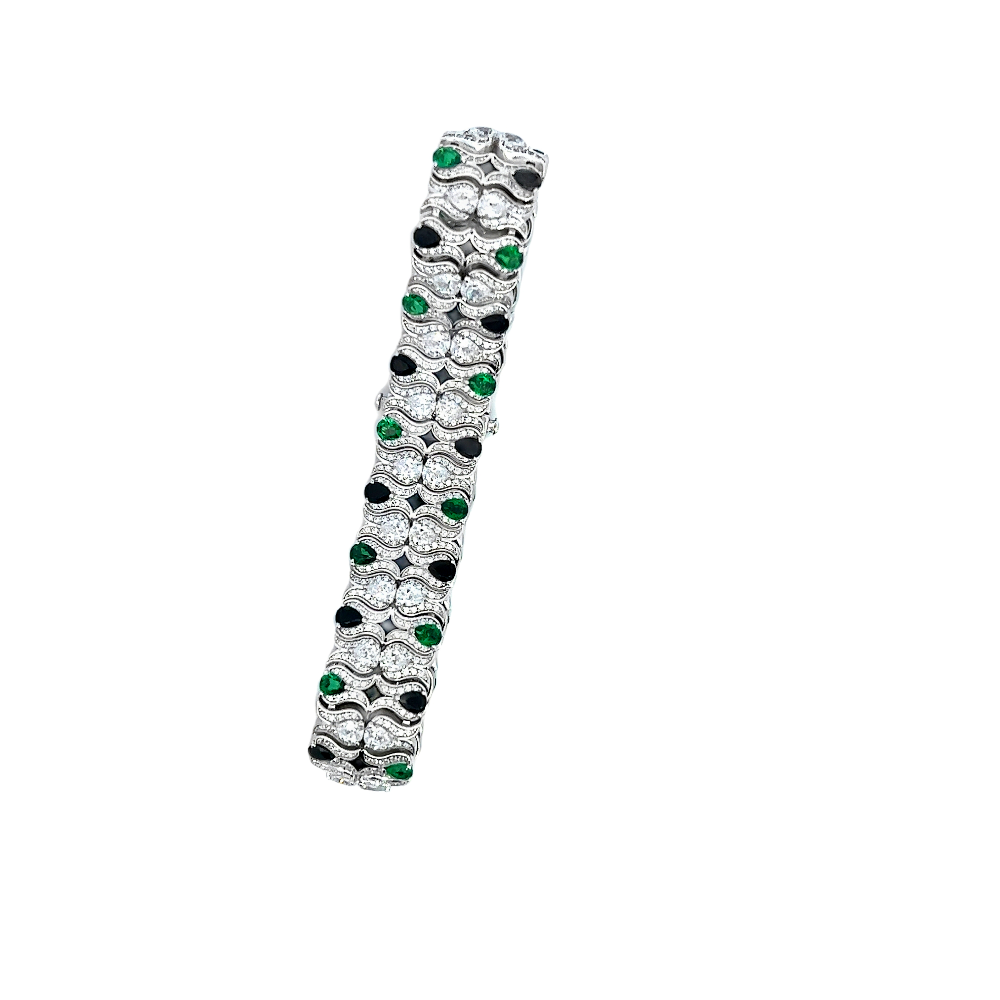 Victorian-style sterling silver bracelet featuring lab-created emeralds, blue sapphires, and sparkling cubic zirconia for a bold timeless statement. Shop premium jewelry online.