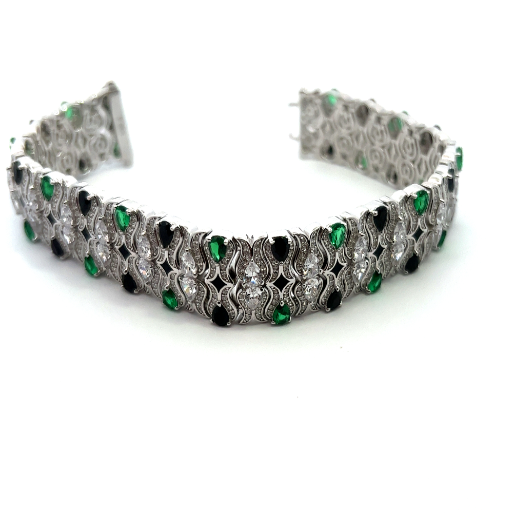 Victorian-style sterling silver bracelet featuring lab-created emeralds, blue sapphires, and sparkling cubic zirconia for a bold timeless statement. Shop premium jewelry online.