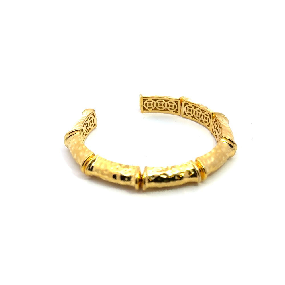 Elegant 22K gold plated cuff bracelet with intricate detailing and an adjustable fit. A timeless statement piece for every occasion. Shop premium jewelry online.