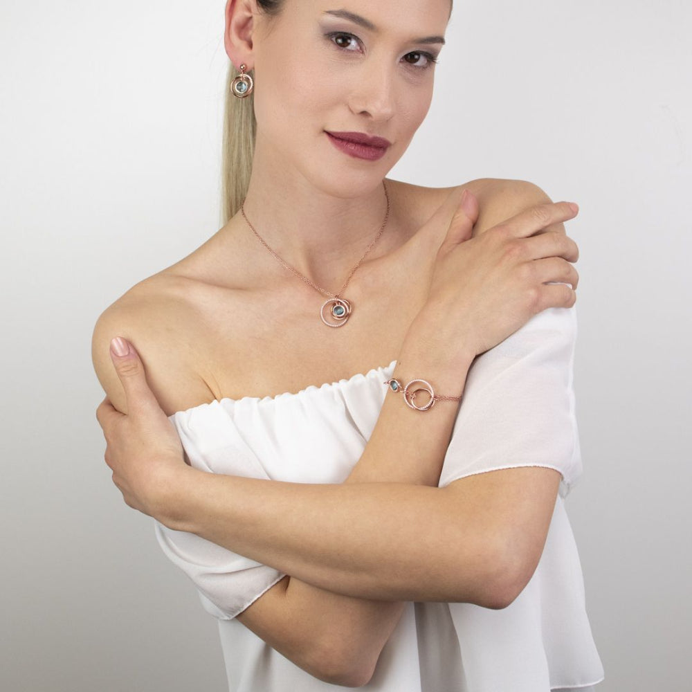 Shop online premium rose gold necklace with sky blue crystal circles and sparkling cubic zirconia details.
