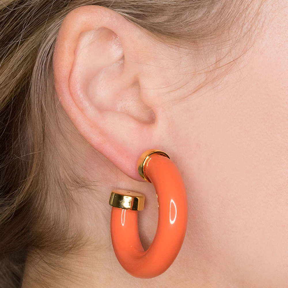 Complete your collection with these coral hoop earrings polished off with gold end caps.