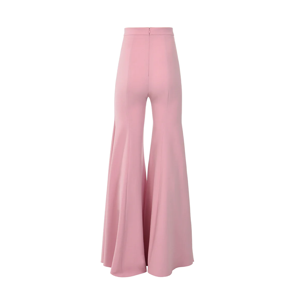 A cotton candy pink feathered cropped top, with crepe bell bottom trousers.