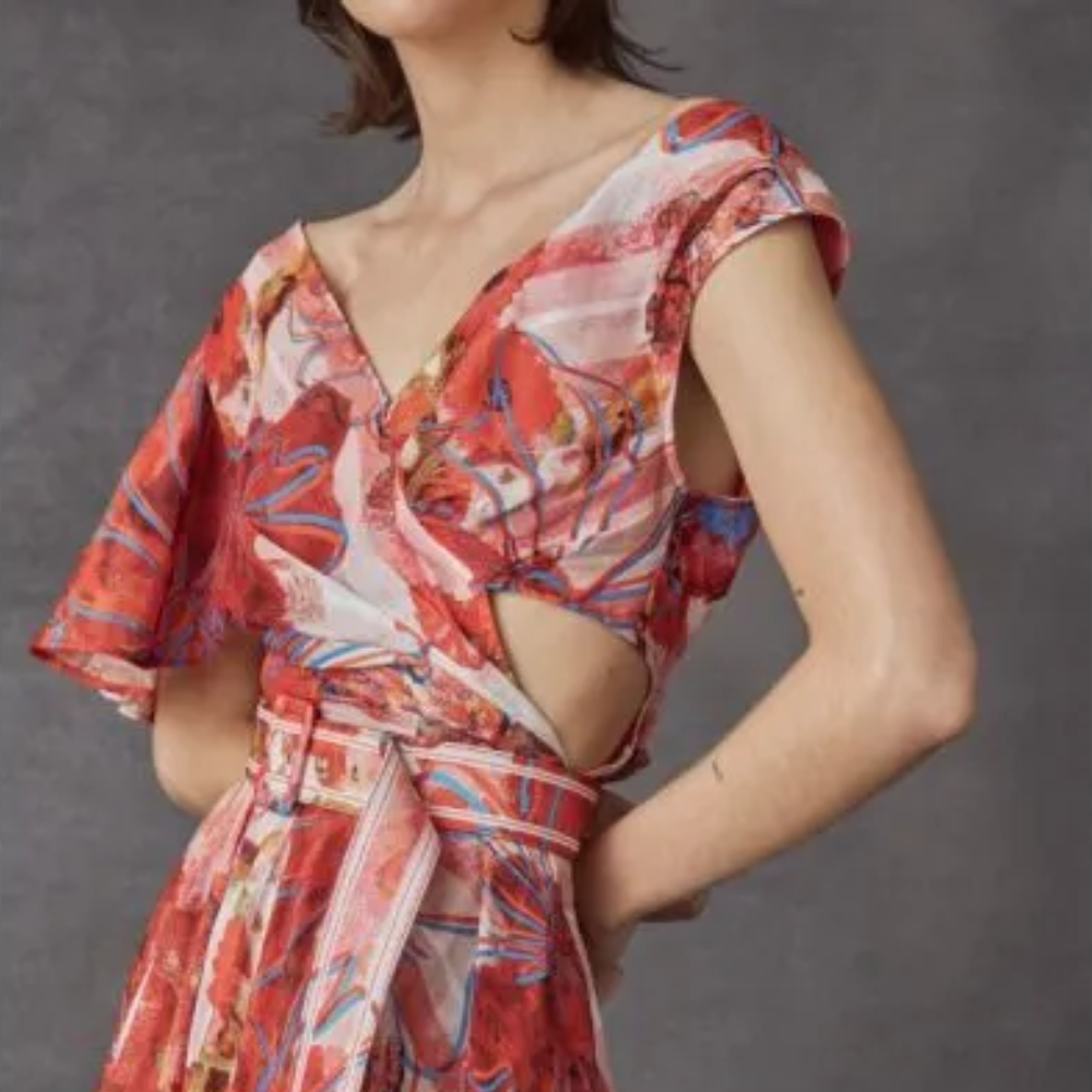 In silk linen, this dress features elongated sharp arrow shirt collar with a gold, metal rivet on top.