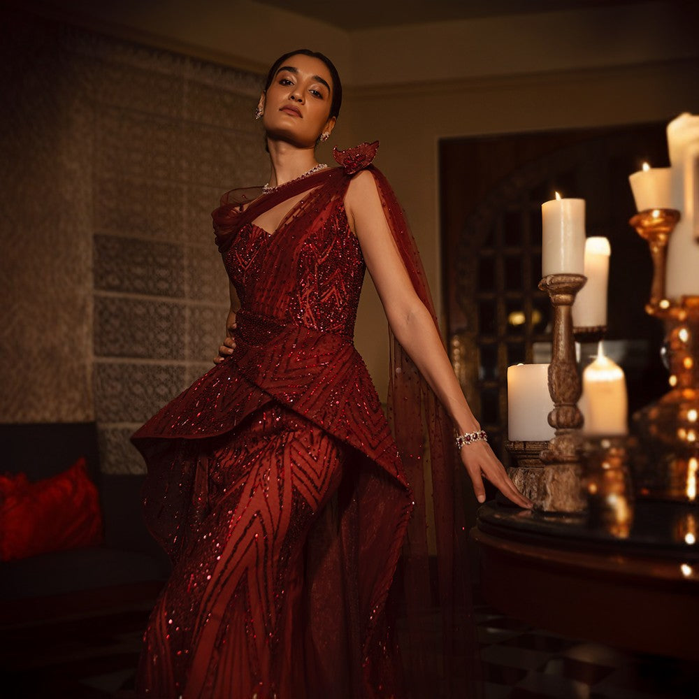 Scintillating Cosmos depicted through Signature embroideries with wraparound bustle over pillar gown with train.