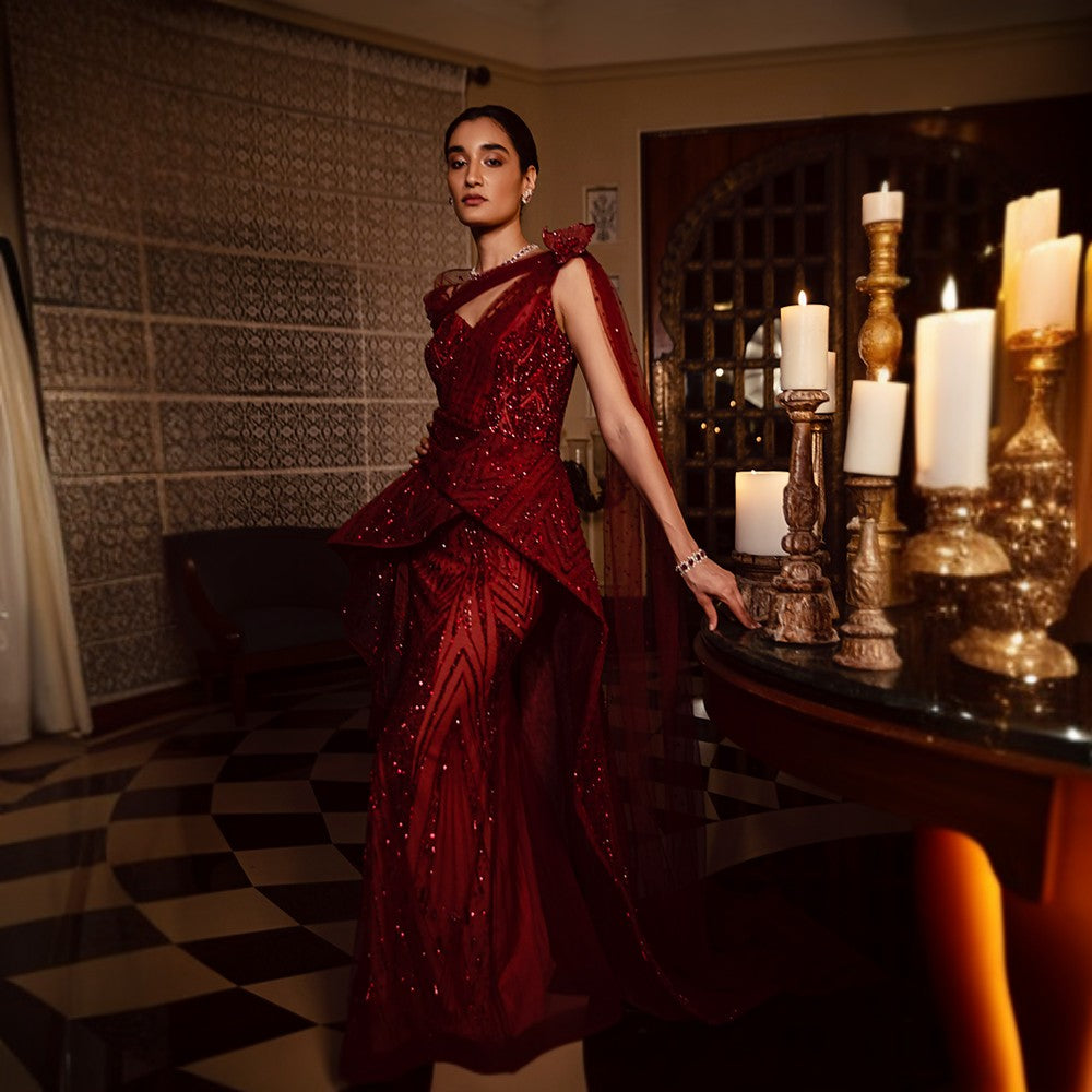 Scintillating Cosmos depicted through Signature embroideries with wraparound bustle over pillar gown with train.