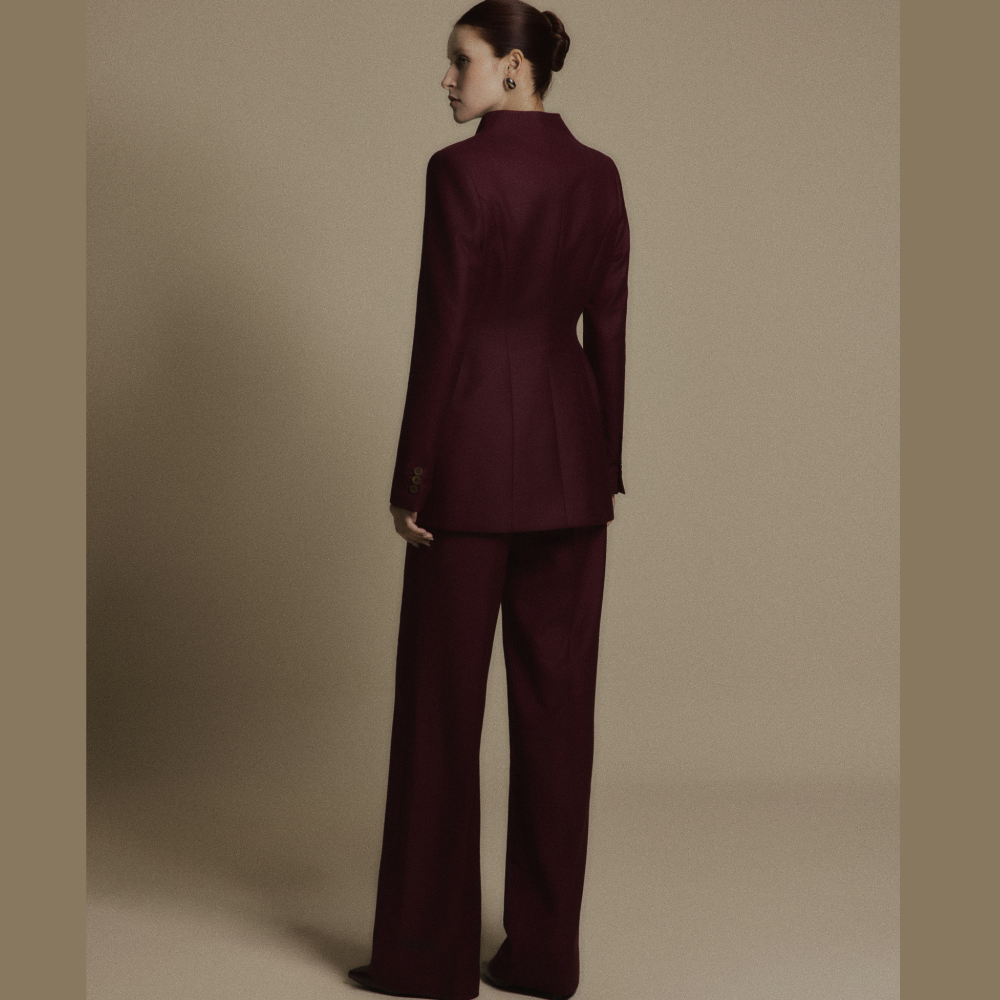 Shop luxury dresses online and elevate your style with the Crimson Minimal Wool Tailored Suit Jacket. Shop Now!