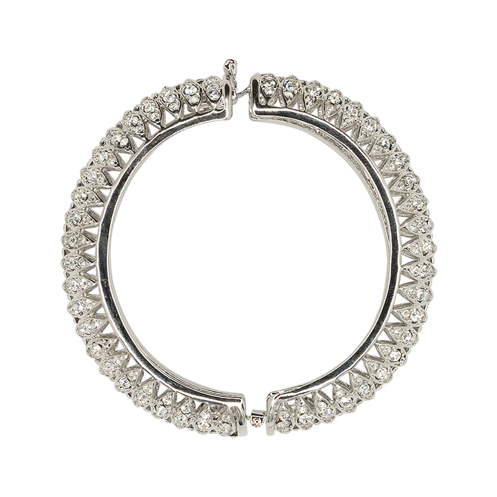 A Jackie Onassis original, this silver bangle with bright pave crystals will glimmer and shine on your wrist. 