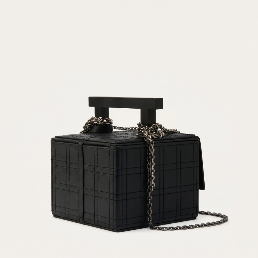 Leather handbag with chain straps and magnetic closure, perfect for daily use. Shop online from our curated edit of premium fashion.