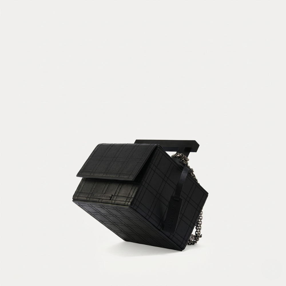 Leather handbag with chain straps and magnetic closure, perfect for daily use. Shop online from our curated edit of premium fashion.