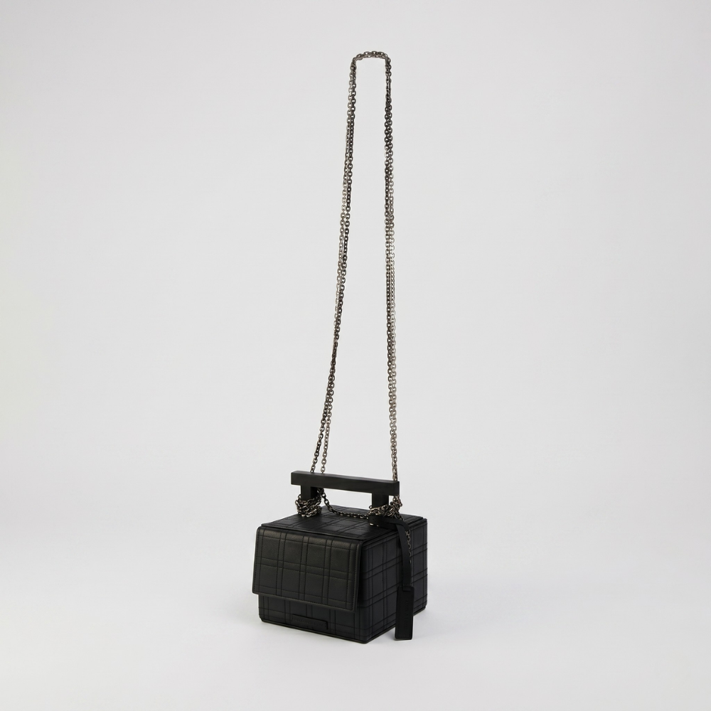Leather handbag with chain straps and magnetic closure, perfect for daily use. Shop online from our curated edit of premium fashion.