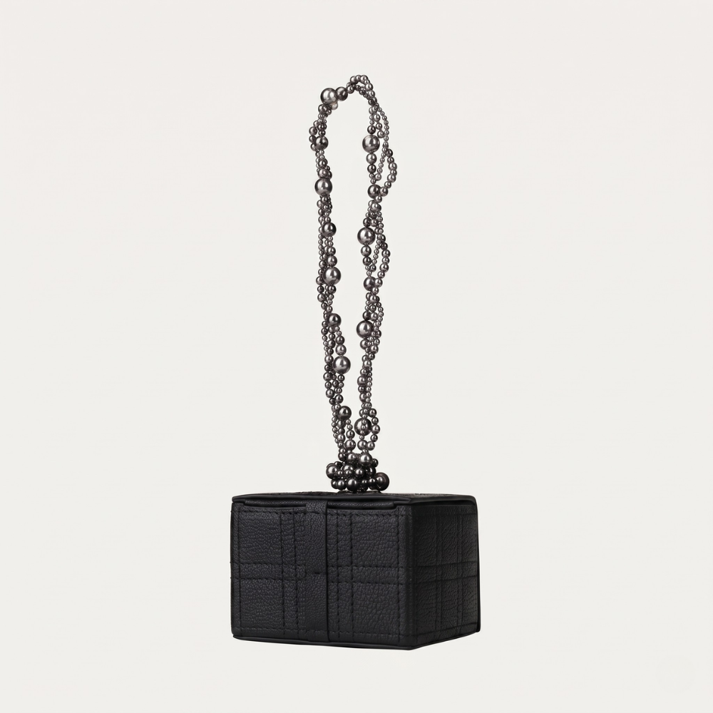 Leather handbag with pearl handle and Swarovski detail, perfect for occasions. Shop online from our curated edit of premium fashion.
