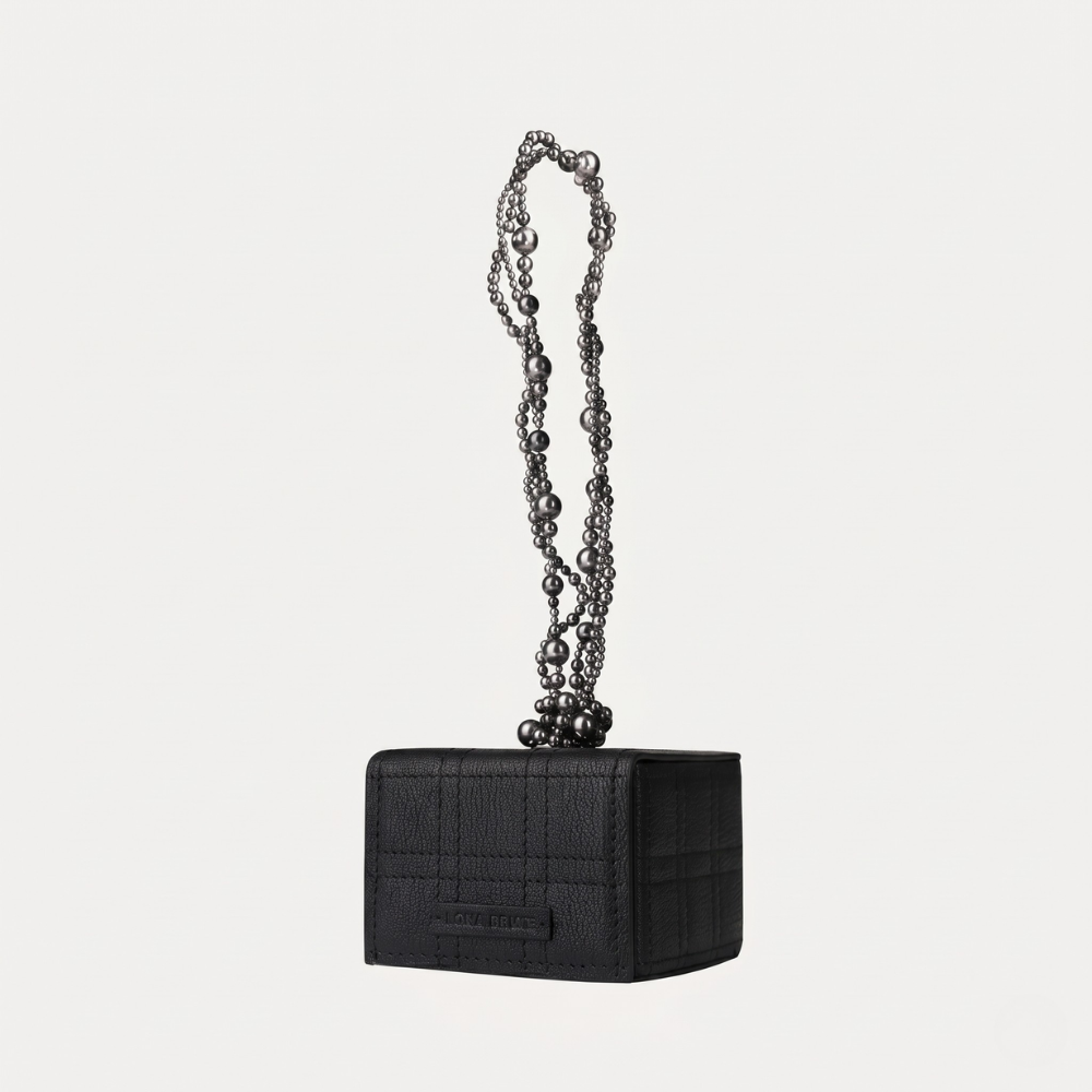 Leather handbag with pearl handle and Swarovski detail, perfect for occasions. Shop online from our curated edit of premium fashion.