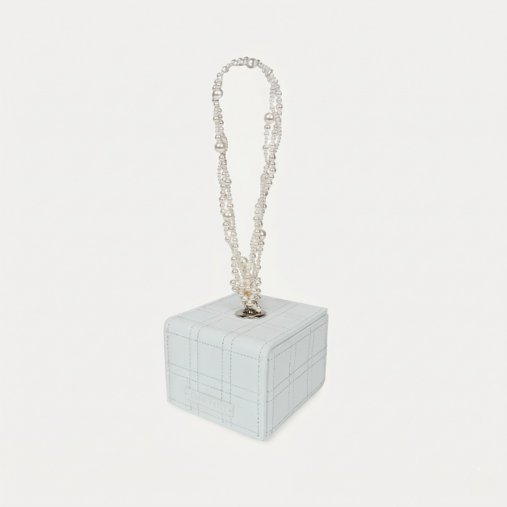 Leather handbag with Swarovski pearl handle and magnetic closure. Shop online from our curated edit of premium fashion.
