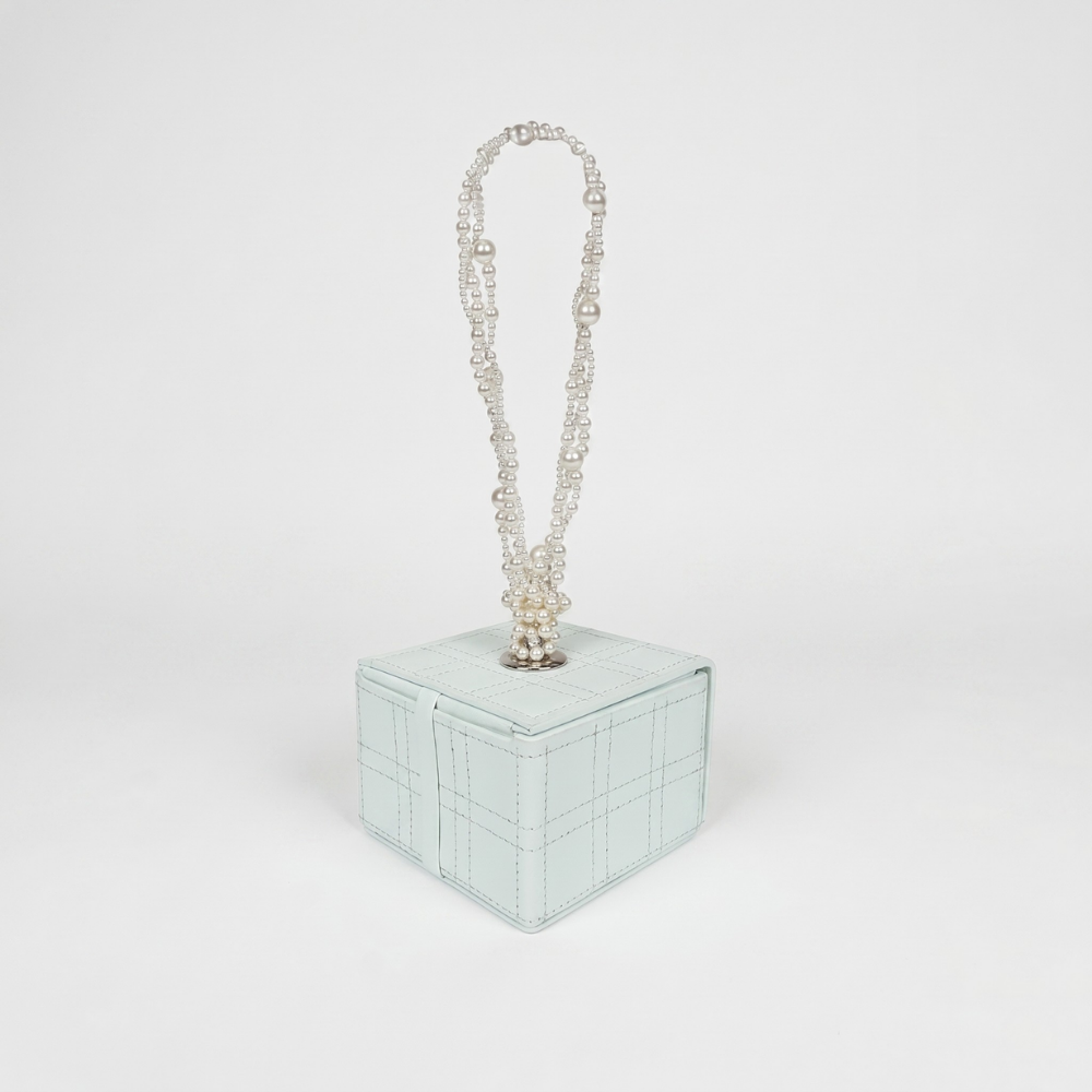 Leather handbag with Swarovski pearl handle and magnetic closure. Shop online from our curated edit of premium fashion.